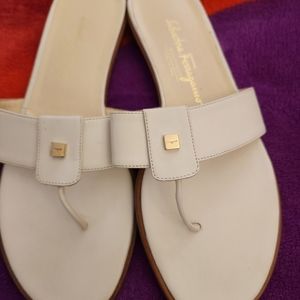 White with gold enbrel. Never been worn. Very comfortable